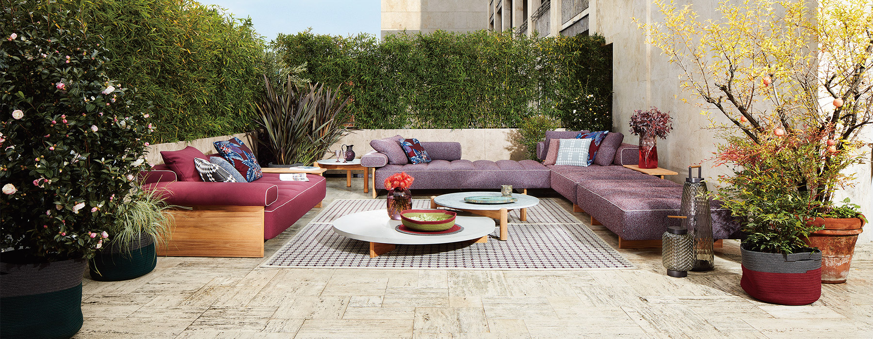 photo credits : DePasquale + Maffini, Sail Out sofa, low table and ottoman designed by Rodolfo Dordoni, Table a Plateau Interchangeable Outdoor designed by Charlotte Perriand